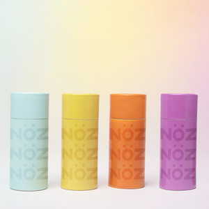 Row of blue yellow orange and purple NOZ sunscreen 